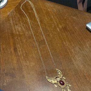 Elegant Gold Necklace with Red Gemstone
